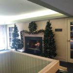 indoor fireplace with christmas decorations at arbors