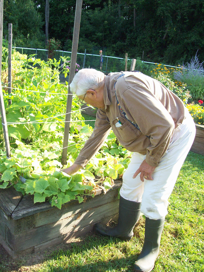 senior resident tending to garden
