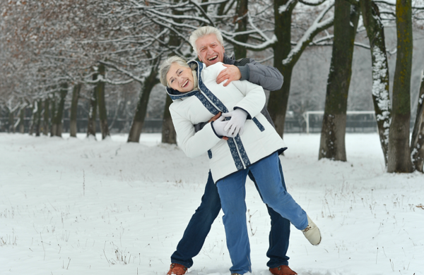 senior couple outdoors with snow