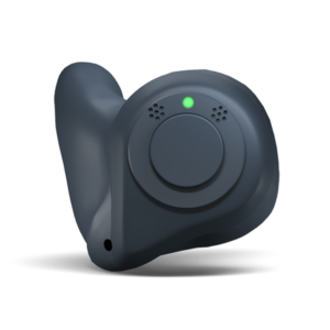 black hearing aid with a green light illuminated on it 