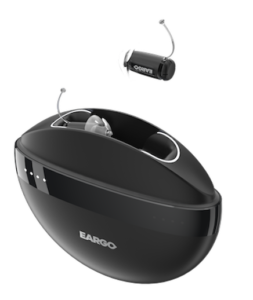 black hearing aids in a round case 