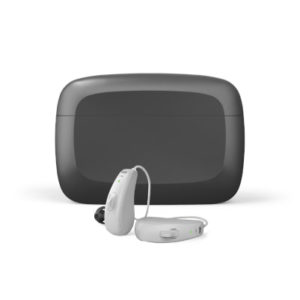 grey hearing aids with a black case 